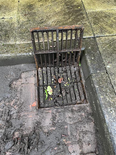 Capital Drainage drain blocked by mud and debris before